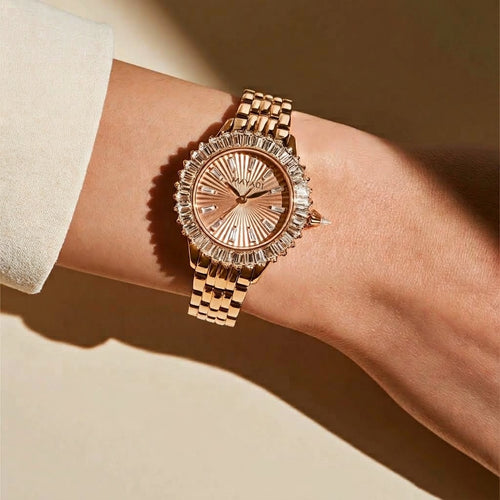 MAYA 01 Amira worn on the wrist in warm sunlight, baguette stones catching the light