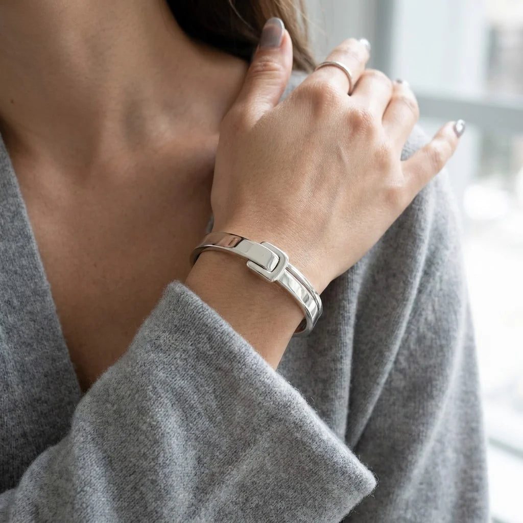 MAYA 01 Antibes buckle cuff in Polished Silver worn with a soft grey knit sweater