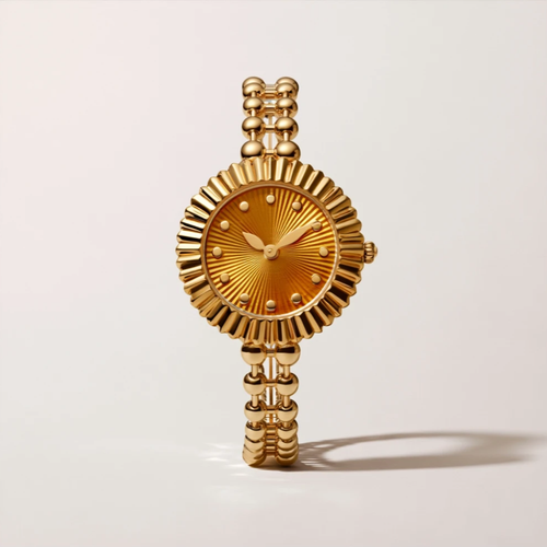 MAYA 01 cabochon gold watch with an amber sunburst dial, fluted bezel and double bead bracelet