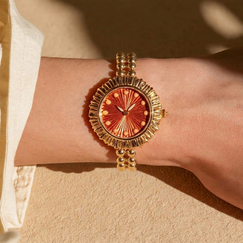 MAYA 01 Cabochon in Amber worn on the wrist in warm sunlight with a linen sleeve