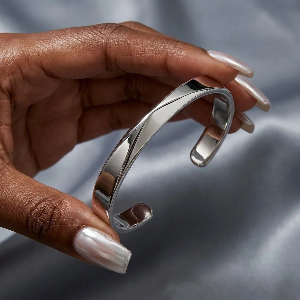 MAYA 01 Mykonos silver cuff held in hand